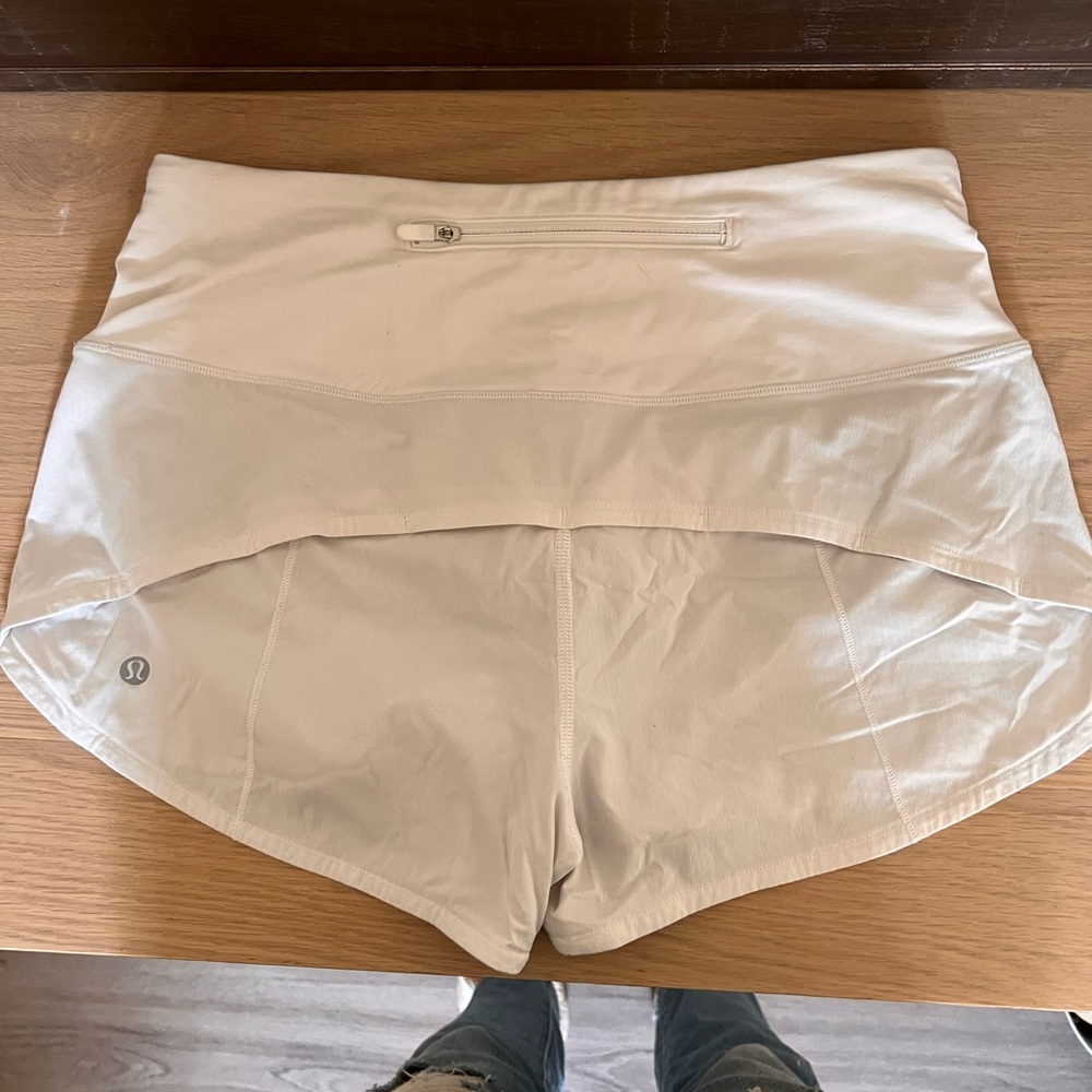 White LuLu speed up high waisted running shorts.